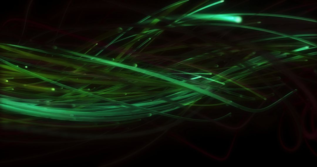 Glowing Green Fibers on Black Background Illustrating Movement