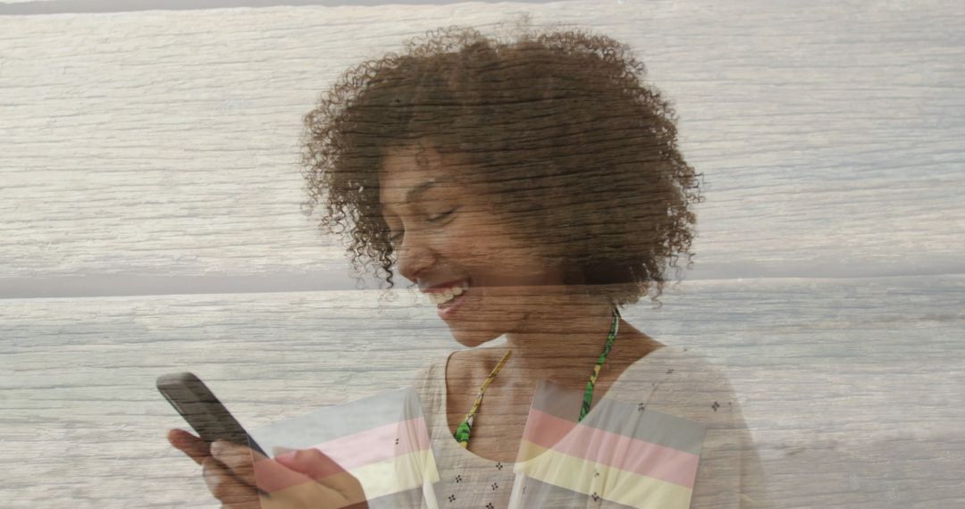 Smiling Woman Using Smartphone at Beach on Relaxing Day