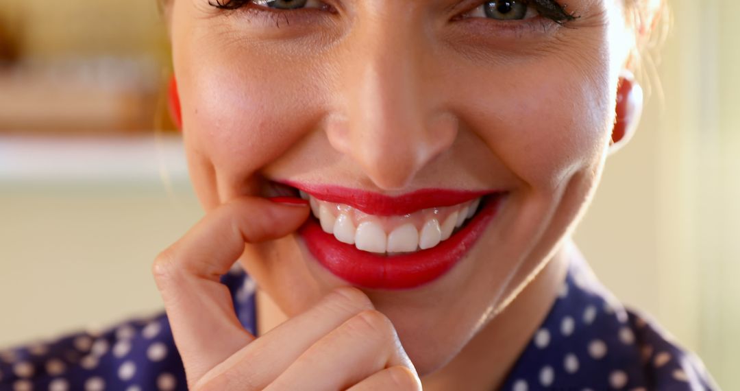 Close-Up of Smiling Woman Biting Finger with Red Lips - Free Images, Stock Photos and Pictures on Pikwizard.com