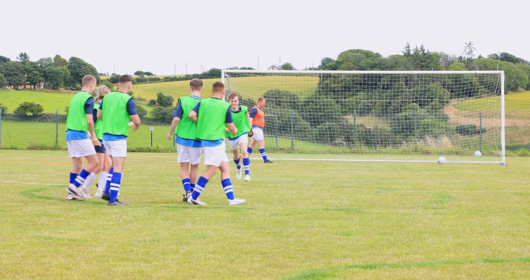 Soccer Practice on Sunny Day with Players in Bibs
