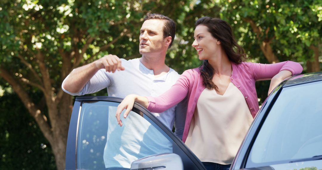 Couple Relaxing by Car, Enjoying Scenic Drive