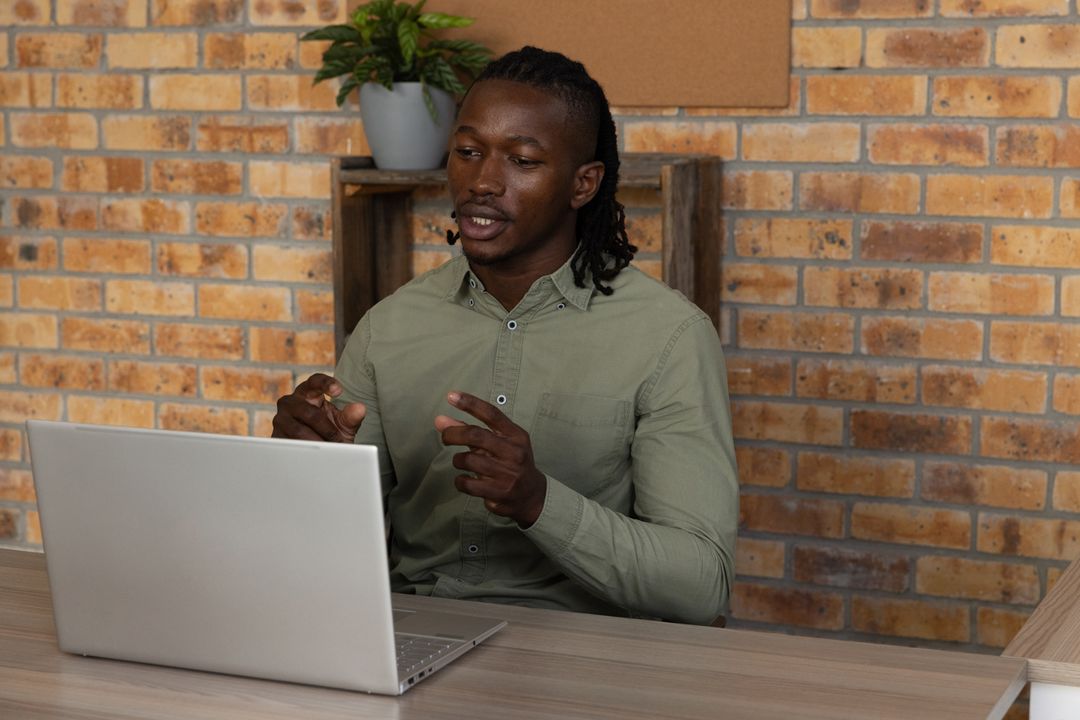 Businessman Discussing Ideas In Modern Office Environment
