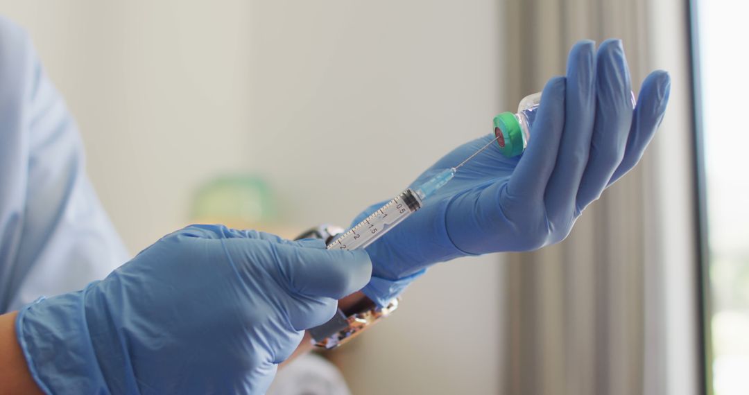 Doctor Preparing Vaccine Injection with Syringe - Free Images, Stock Photos and Pictures on Pikwizard.com