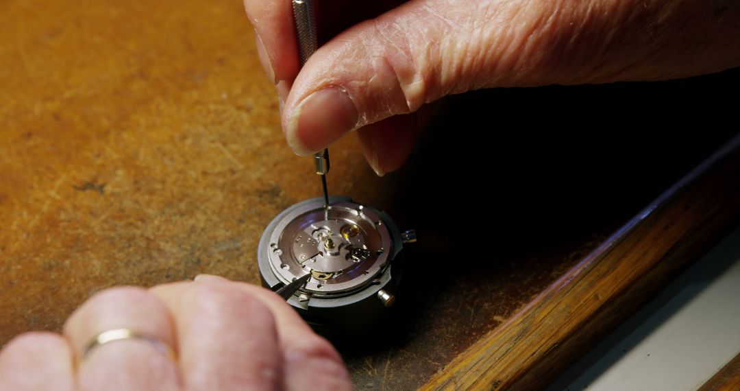 Watchmaker Repairing Intricate Mechanical Watch Part - Free Images, Stock Photos and Pictures on Pikwizard.com