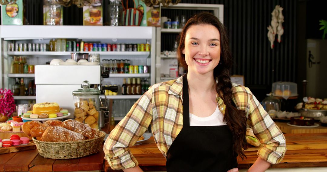 Smiling Female Baker in Bakery Shop with Fresh Pastries - Free Images, Stock Photos and Pictures on Pikwizard.com