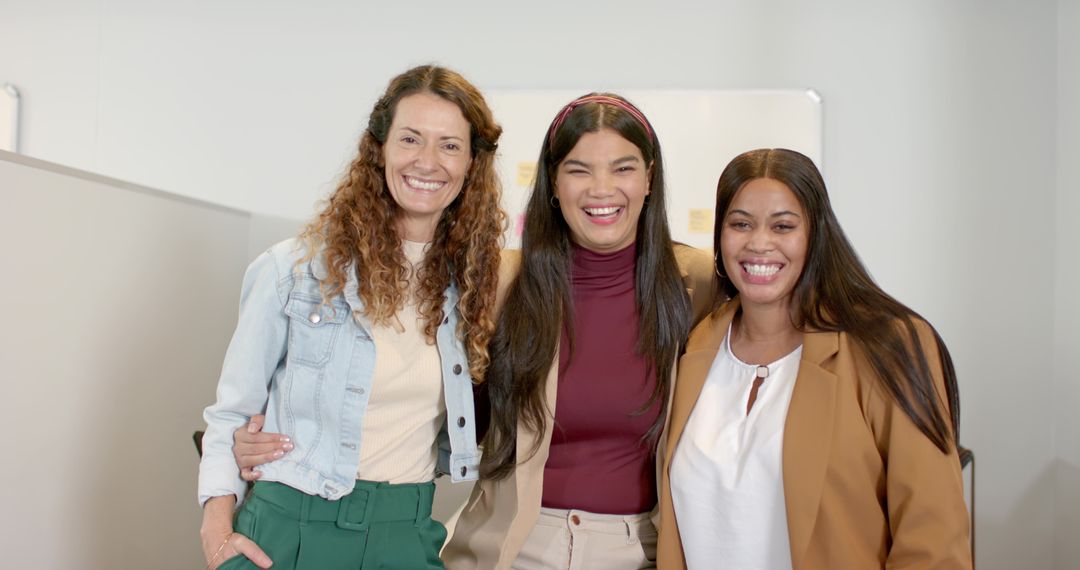 Diverse Female Team Smiling in Modern Office Environment