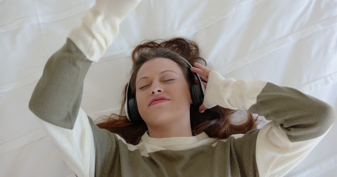 Woman Relaxing and Listening to Music at Home