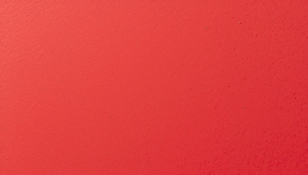Warm Coral Plaster Wall with Subtle Texture and Soft Gradient Lighting