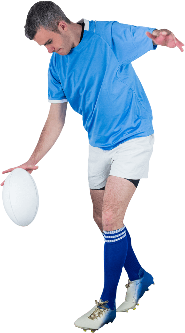 Determined Rugby Player Kicking Ball in Transparent Background