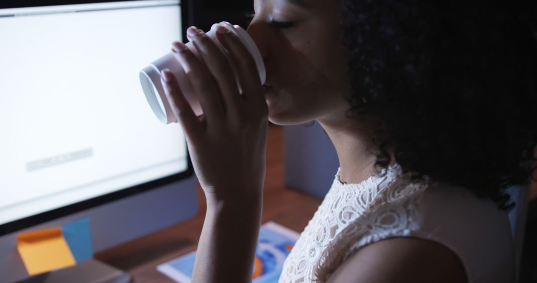 Young Woman Enjoying Coffee Break at Office Desk - Free Images, Stock Photos and Pictures on Pikwizard.com