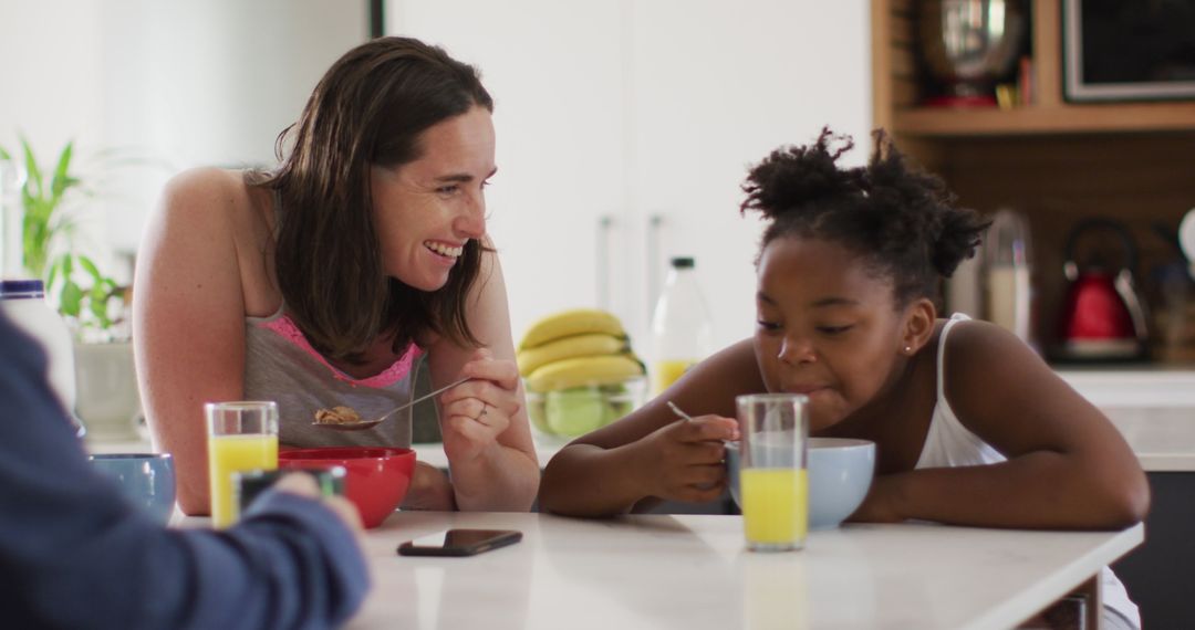 Loving Family Breakfast with Mother and Daughter Enjoying Meal