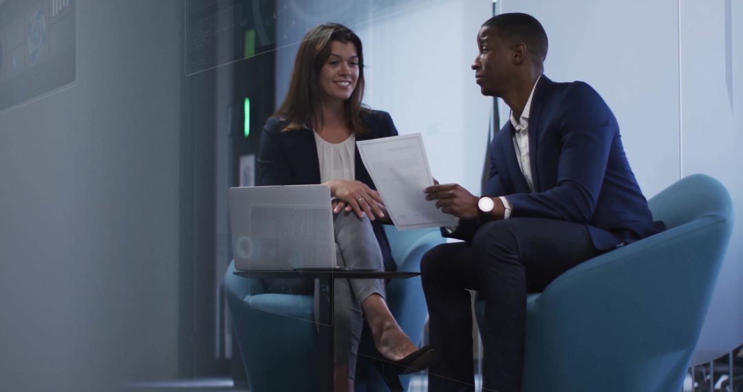 Colleagues Discussing Financial Data in Modern Office Space