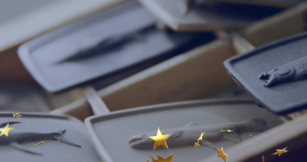 Handcrafted Fish-Shaped Casts on Rustic Wooden Rack in Workshop