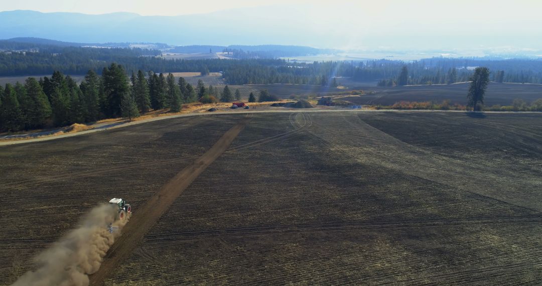 Tractor Plowing Soil in Rural Countryside for New Crop Cycle