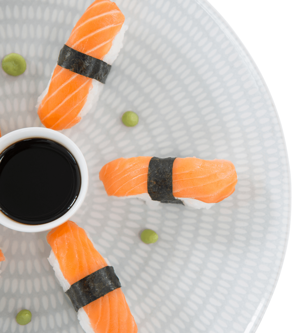 Transparent Plate of Sushi with Soy Sauce and Wasabi Artfully Arranged