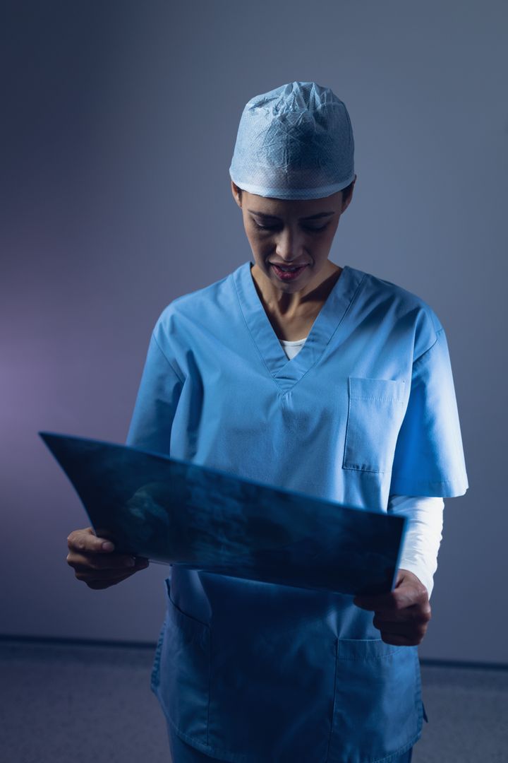 Female surgeon examining x-ray in operating room - Free Images, Stock Photos and Pictures on Pikwizard.com