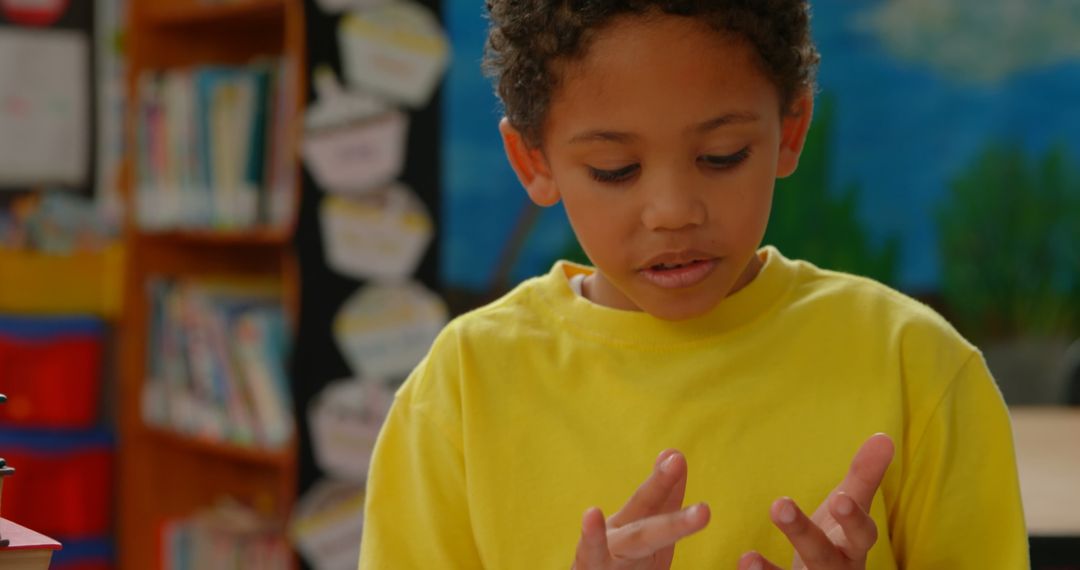 Young Boy Concentrated on Math Problem in Classroom