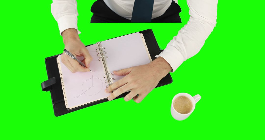 Overhead View of Businessman's Hands Writing in Notebook with Coffee - Free Images, Stock Photos and Pictures on Pikwizard.com