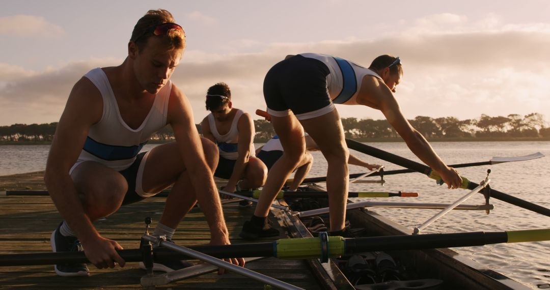 Rowers Preparing for Early Morning Training on Dock - Free Images, Stock Photos and Pictures on Pikwizard.com