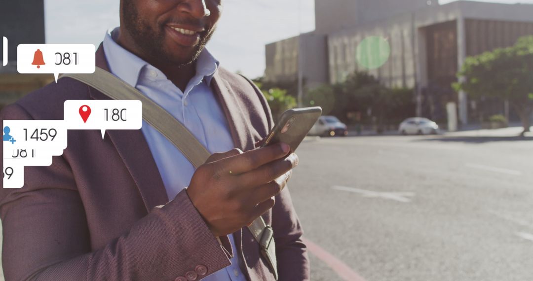 Smiling Businessman Receiving Lots of Smartphone Notifications