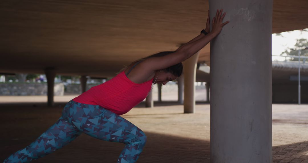 Woman Stretching Outdoors in Urban Area - Free Images, Stock Photos and Pictures on Pikwizard.com