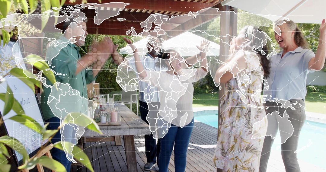 Intergenerational backyard celebration clapping around picnic table with world map overlay