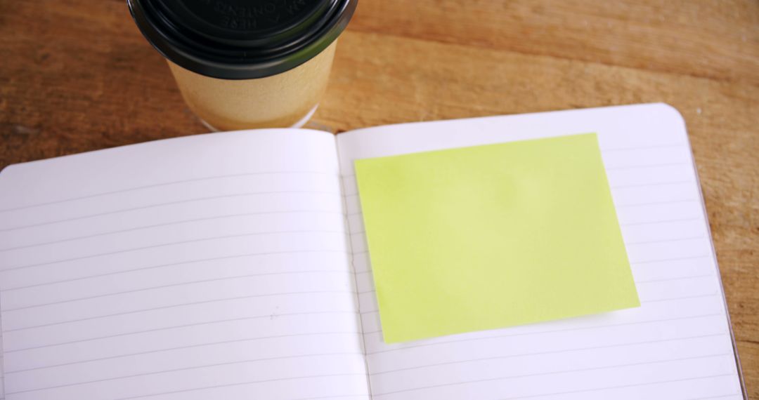 Blank Sticky Note on an Open Notebook Next to Coffee - Free Images, Stock Photos and Pictures on Pikwizard.com