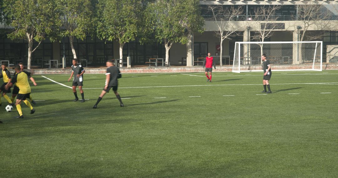 Soccer Players Practicing on Field Demonstrating Team Spirit