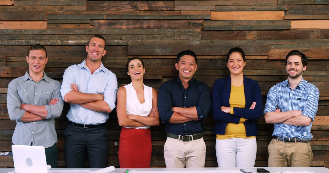 Smiling Multi-Ethnic Team Standing Together in Urban Office - Free Images, Stock Photos and Pictures on Pikwizard.com