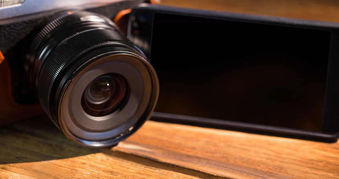 Digital Camera and Smartphone on Wooden Surface