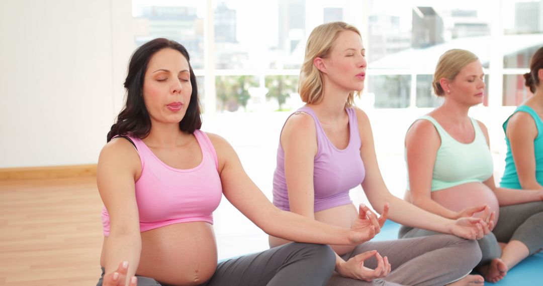 Pregnant Women Meditating Together in Yoga Class - Free Images, Stock Photos and Pictures on Pikwizard.com