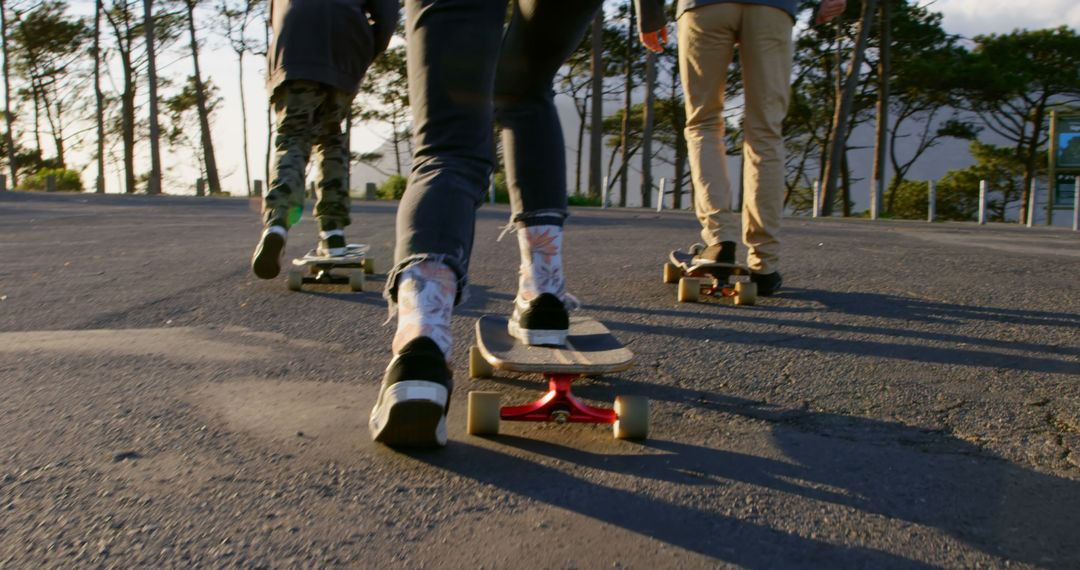 Group of Friends Skateboarding in Parking Lot at Sunset - Free Images, Stock Photos and Pictures on Pikwizard.com