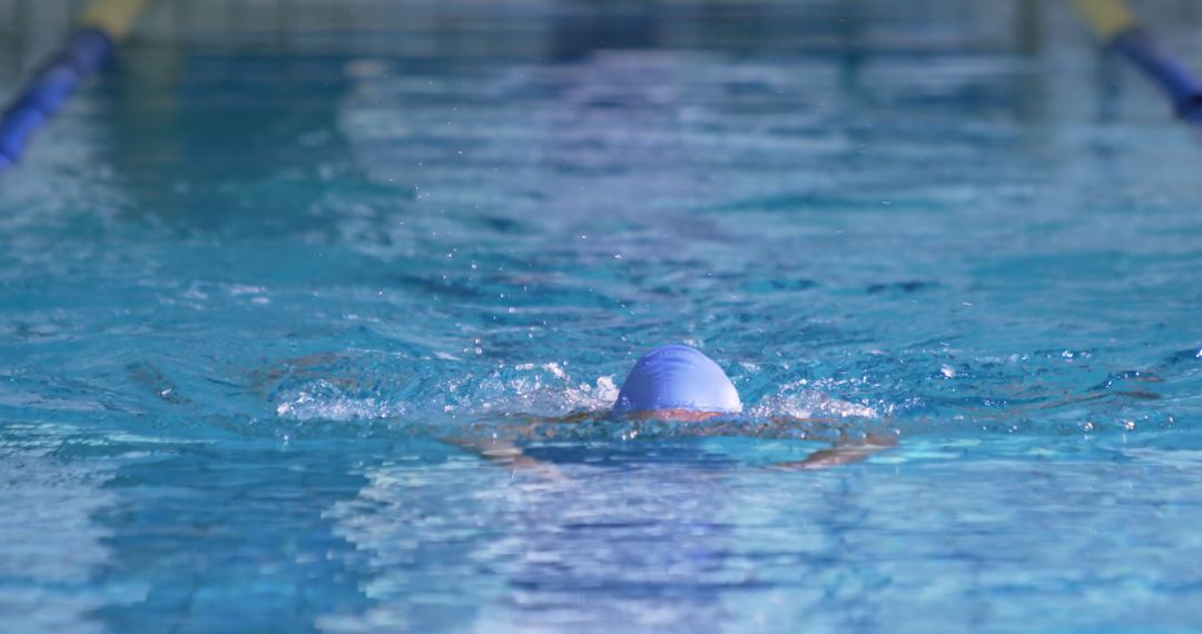 Swimmer Freestyle Stroke in Indoor Pool during Training Session - Free Images, Stock Photos and Pictures on Pikwizard.com