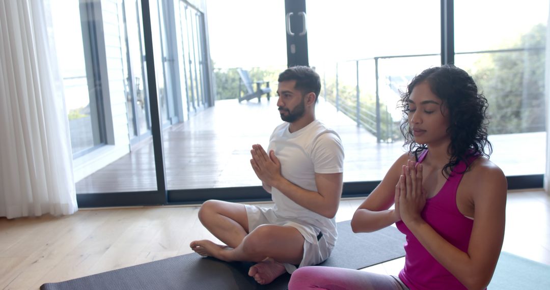 Diverse Couple Practicing Mindful Meditation in Modern Home - Free Images, Stock Photos and Pictures on Pikwizard.com