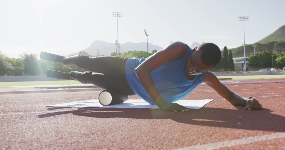 Athletic Man with Prosthetics Staying Fit at Sunlit Stadium