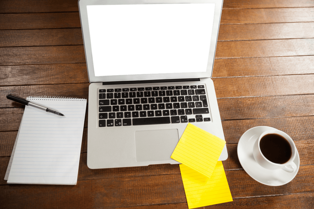 Laptop with Coffee and Notepads on Wooden Table Top View
