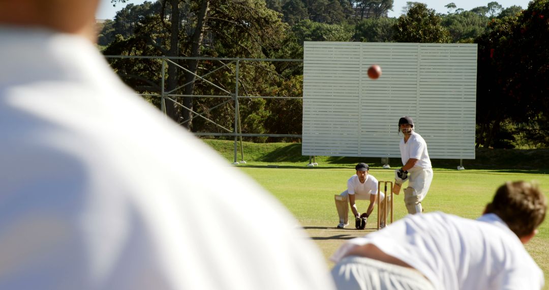 Cricketer batting against bowler outdoor on a sunny day - Free Images, Stock Photos and Pictures on Pikwizard.com