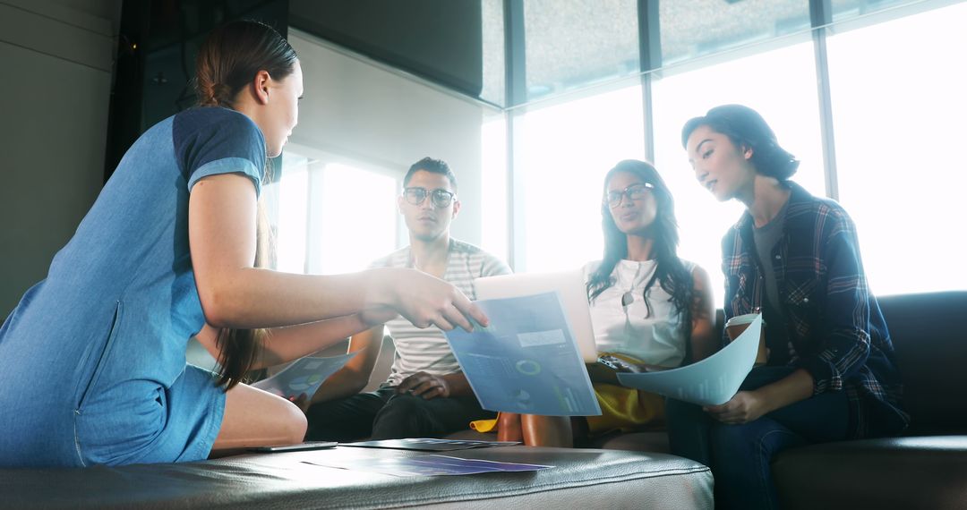Diverse Team Collaborating in Casual Meeting Room