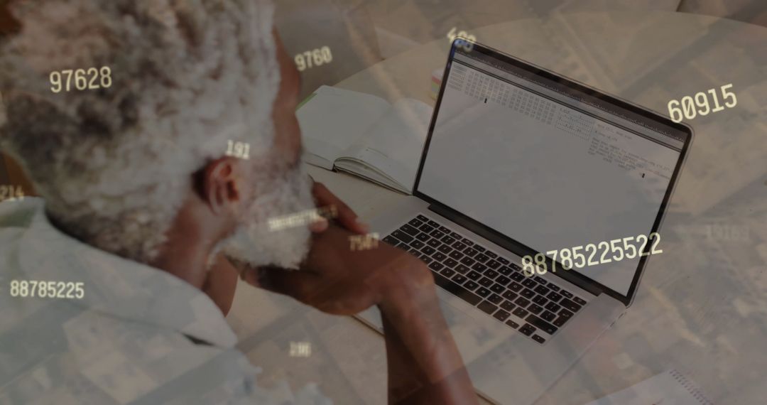 Financial Analyst Examining Data on Laptop with Overlay of Figures