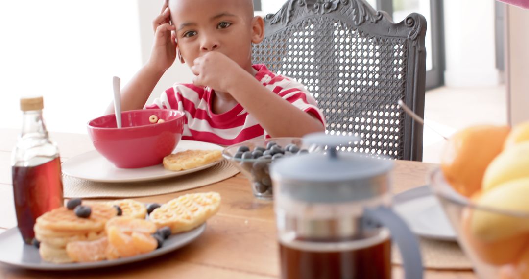 Young Boy Enjoying Breakfast with Waffles and Fruit - Free Images, Stock Photos and Pictures on Pikwizard.com