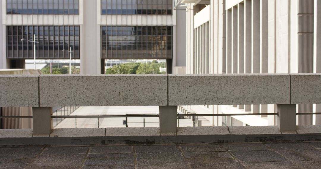 Concrete Parapet Framing Empty Urban Plaza with Gridlike Office Architecture