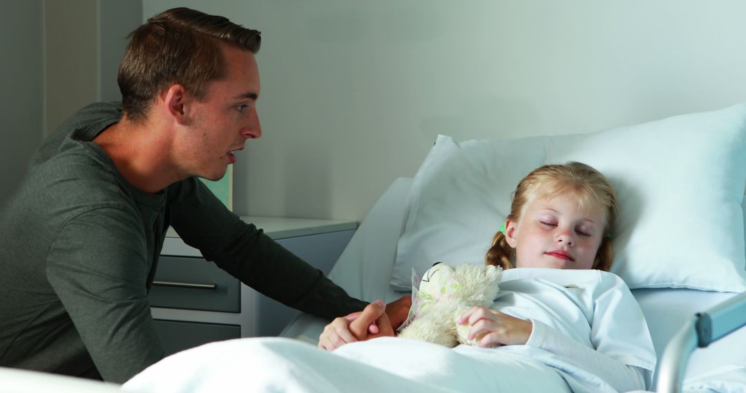 Concerned Father Comforting Sick Daughter in Hospital Bed - Free Images, Stock Photos and Pictures on Pikwizard.com