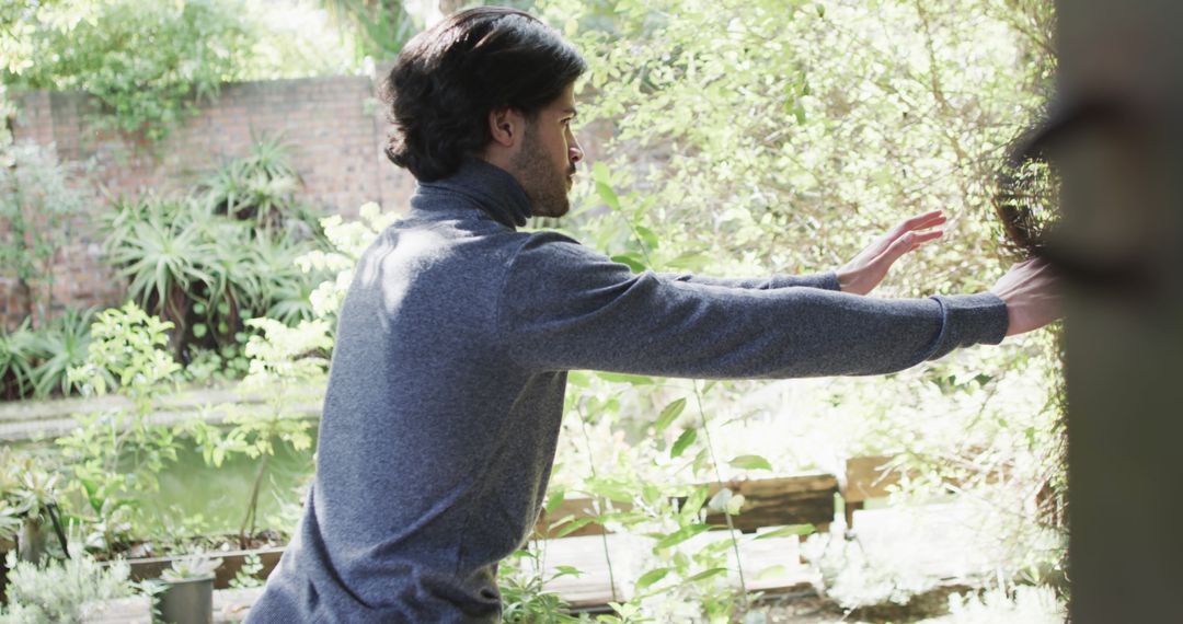 Man Practicing Tai Chi in Serene Garden Setting - Free Images, Stock Photos and Pictures on Pikwizard.com