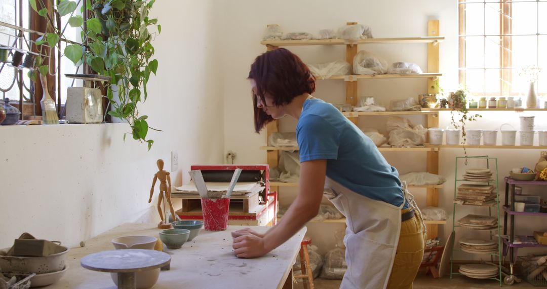 Woman Working on Pottery in Art Studio - Free Images, Stock Photos and Pictures on Pikwizard.com