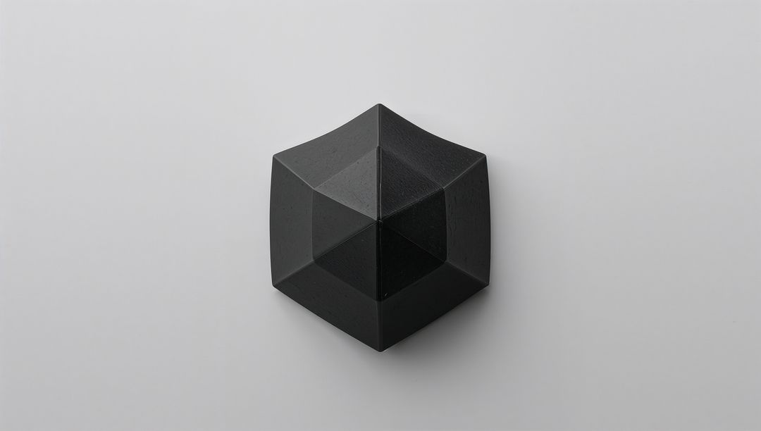 Matte Black Faceted Hexagonal Polyhedron on Light Gray Surface