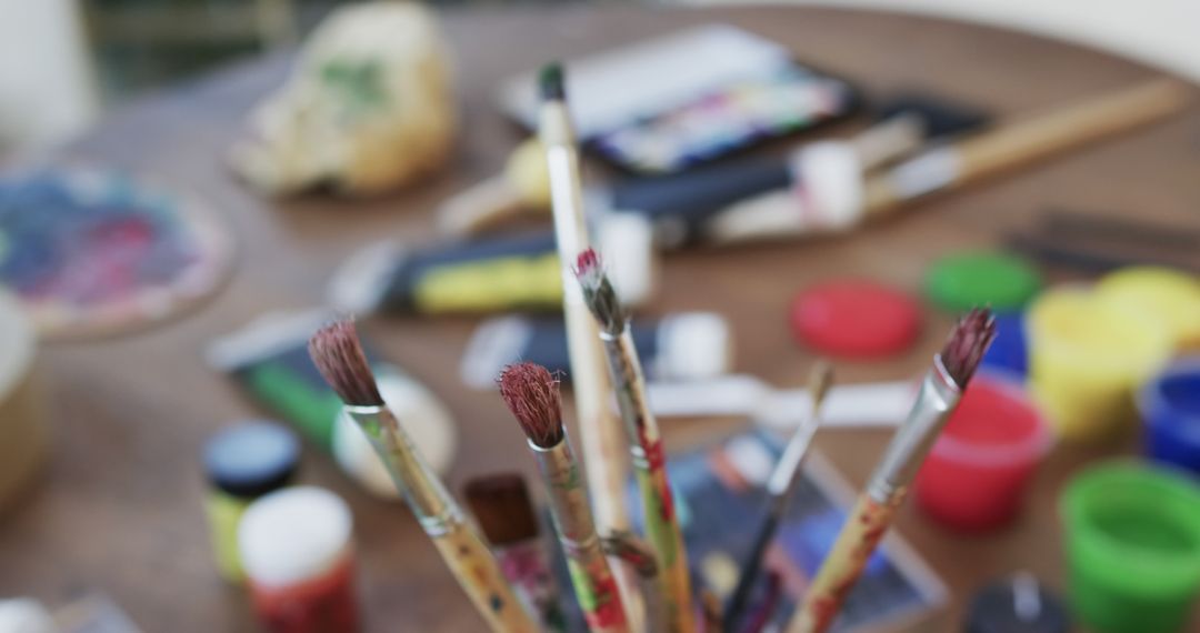 Close-Up of Paintbrushes on Artistic Workspace Table - Free Images, Stock Photos and Pictures on Pikwizard.com