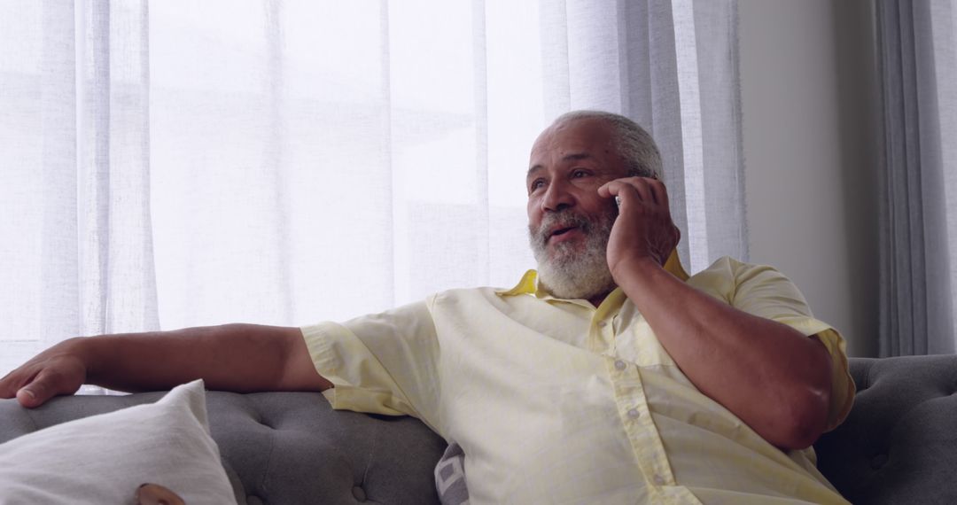 Senior Man Relaxing on Couch While Talking on Phone - Free Images, Stock Photos and Pictures on Pikwizard.com