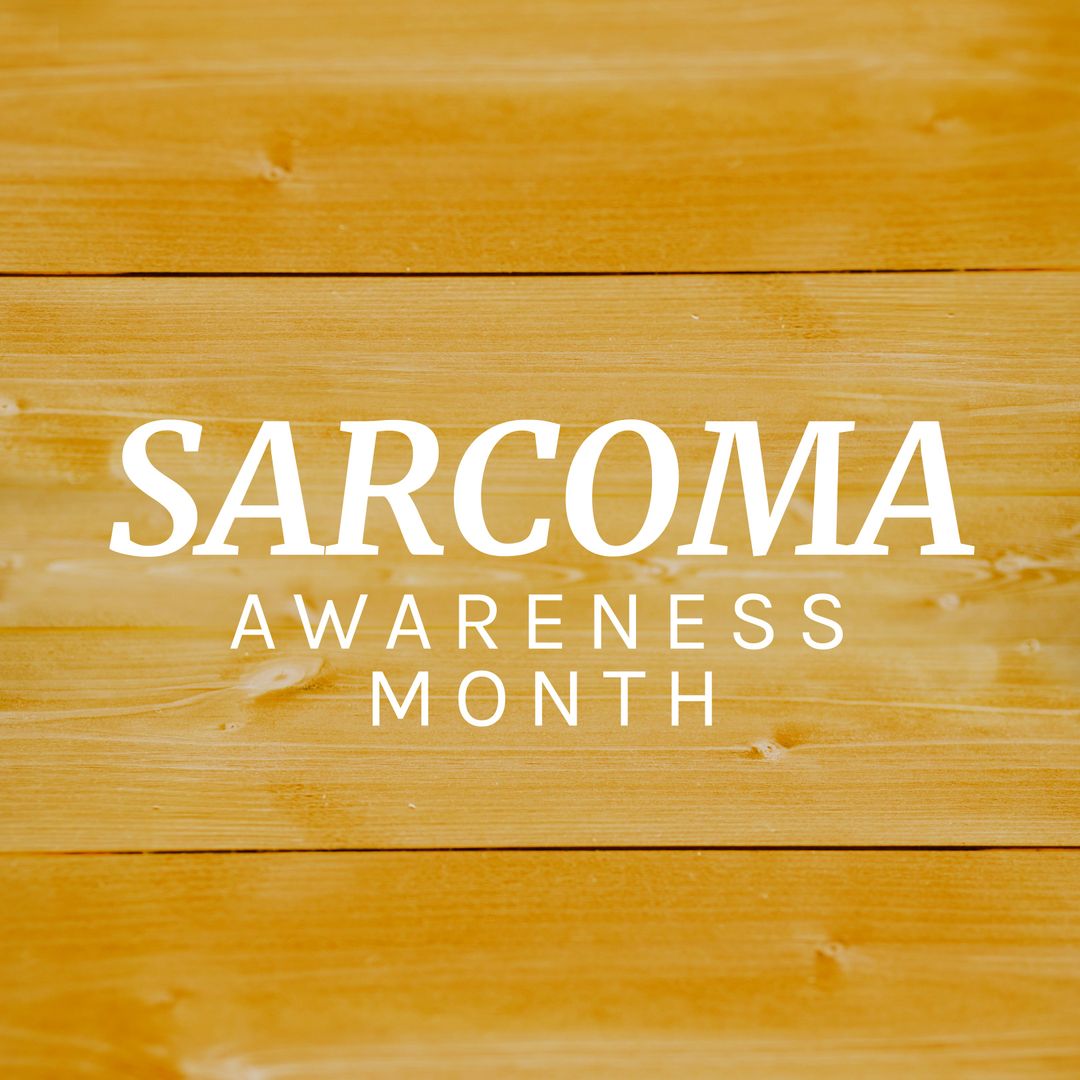 Sarcoma Awareness Month Text on Wooden Background Highlighting Cancer Awareness