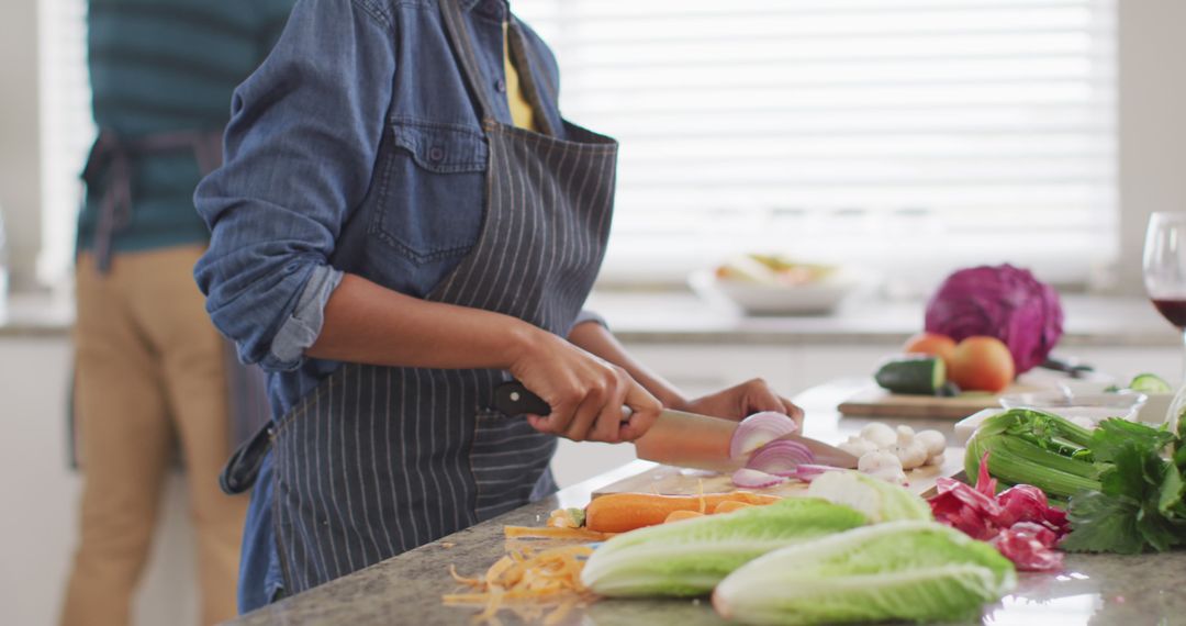 Person Preparing Vegetables in Modern Kitchen - Free Images, Stock Photos and Pictures on Pikwizard.com