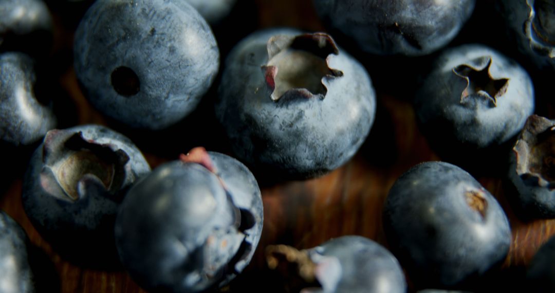 Macro Shot of Fresh Blueberries on Wooden Surface - Free Images, Stock Photos and Pictures on Pikwizard.com